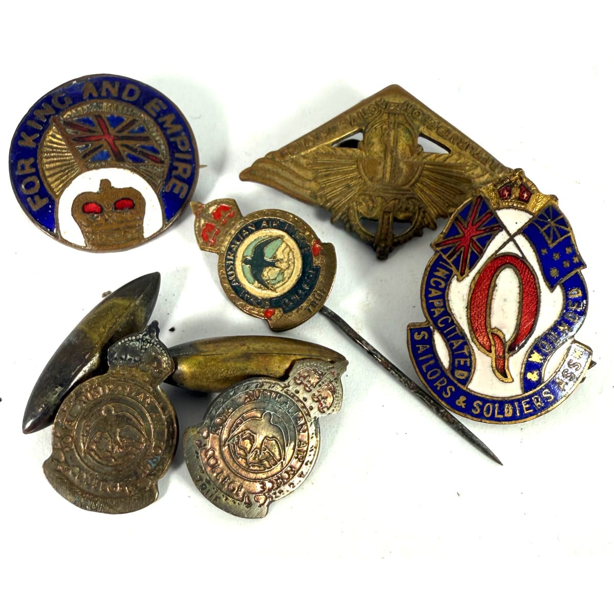 6 Items. Royal Australian Air Force College pin and cufflinks; For King & Empire enamel badge; Returned from active service badge; Incapictated Soldiers & Sailors League badge.