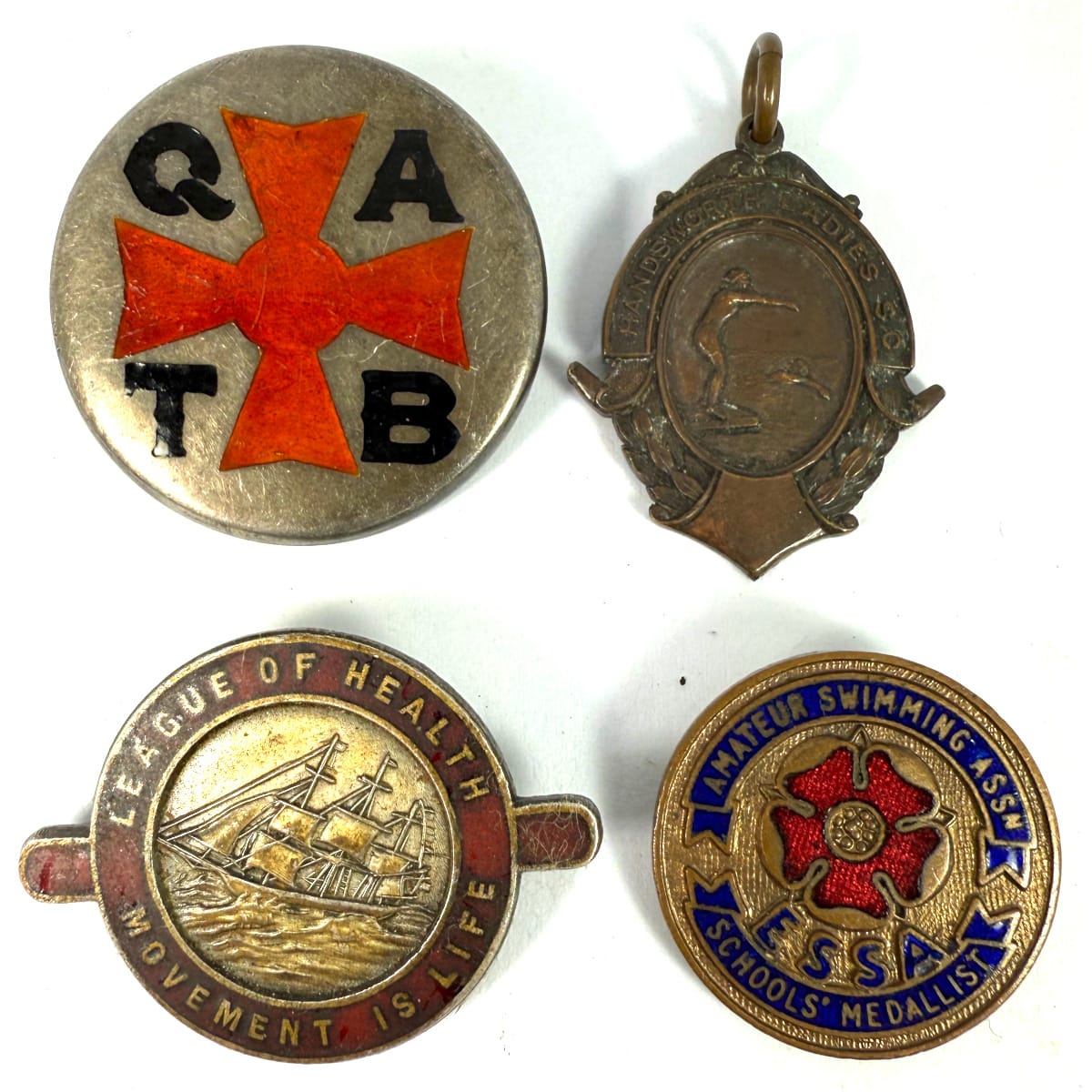 4 Badges: QATB; ESSA Swimming; Handsworth Ladies awarded to B. Griffiths 1928; League of Health.