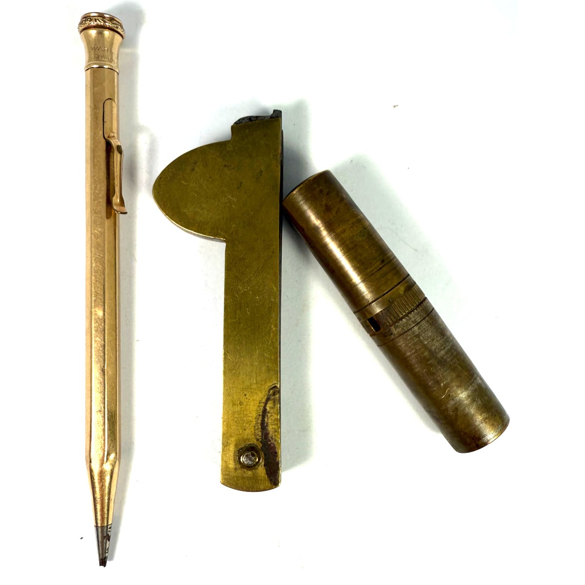 3 small brass items: Retractable pencil; Blood letting knife and fold away travel tool with attachments for a corkscrew, knife, screwdriver and more.