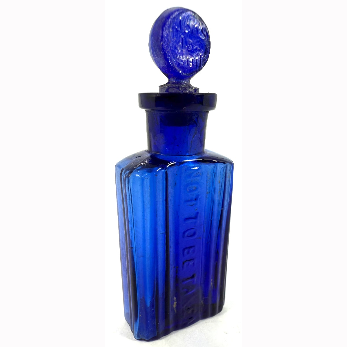 Poison. Oblong Not to be taken. Half ounce. 55 mm. With a stopper that appears to have sons la nuit embossed (night sounds?)