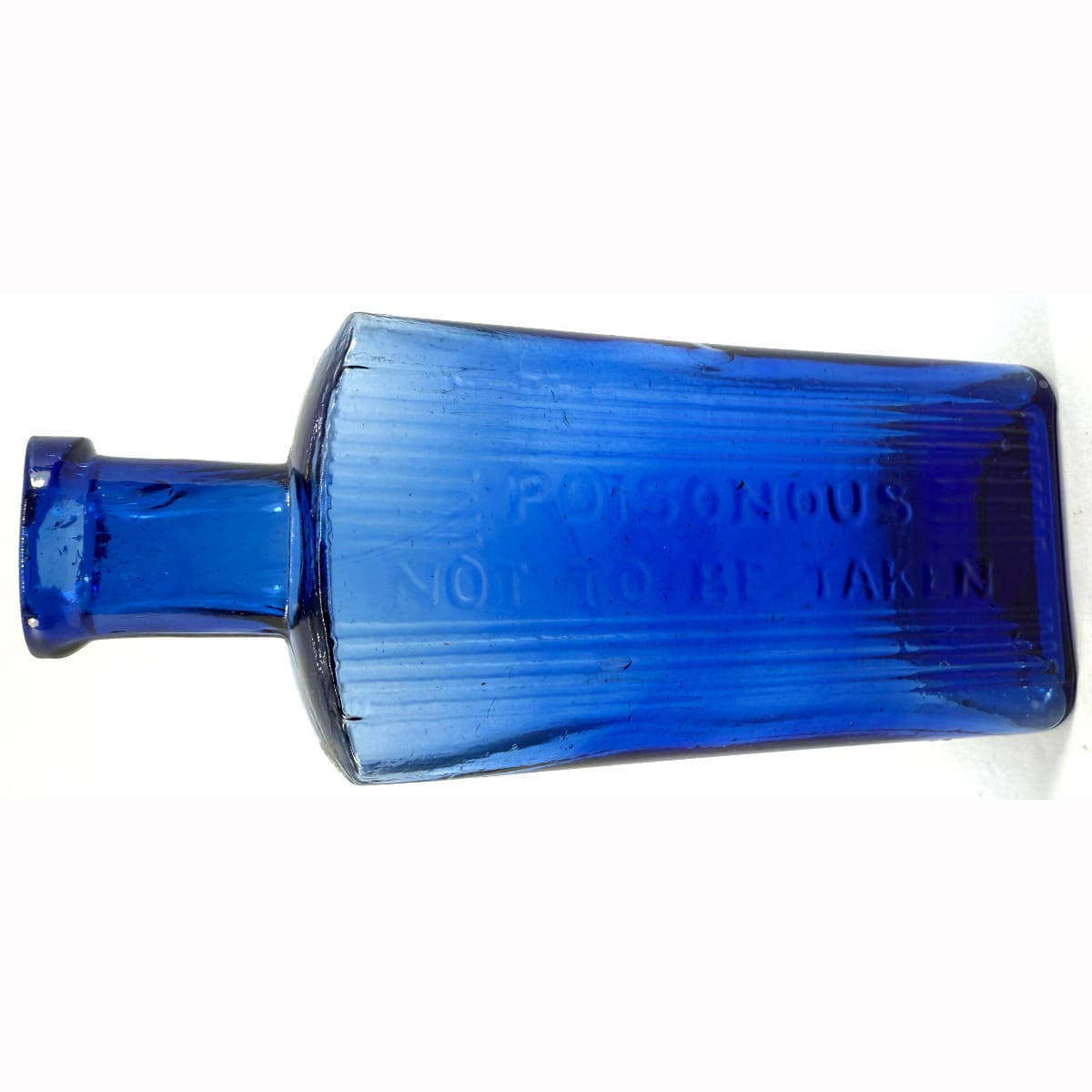 Poison. Oblong. Poisonous, Not to be taken. Lines down front only. Mid Cobalt Blue. 2 oz. 109 mm.