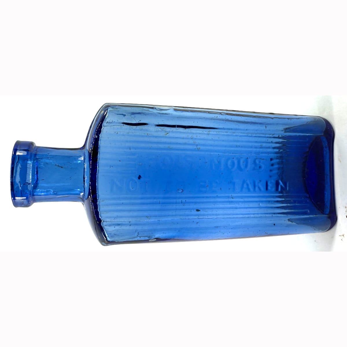 Poison. Oblong. Poisonous, Not to be taken. Lines down front only. Mid Cobalt Blue. 3 oz. 118 mm.