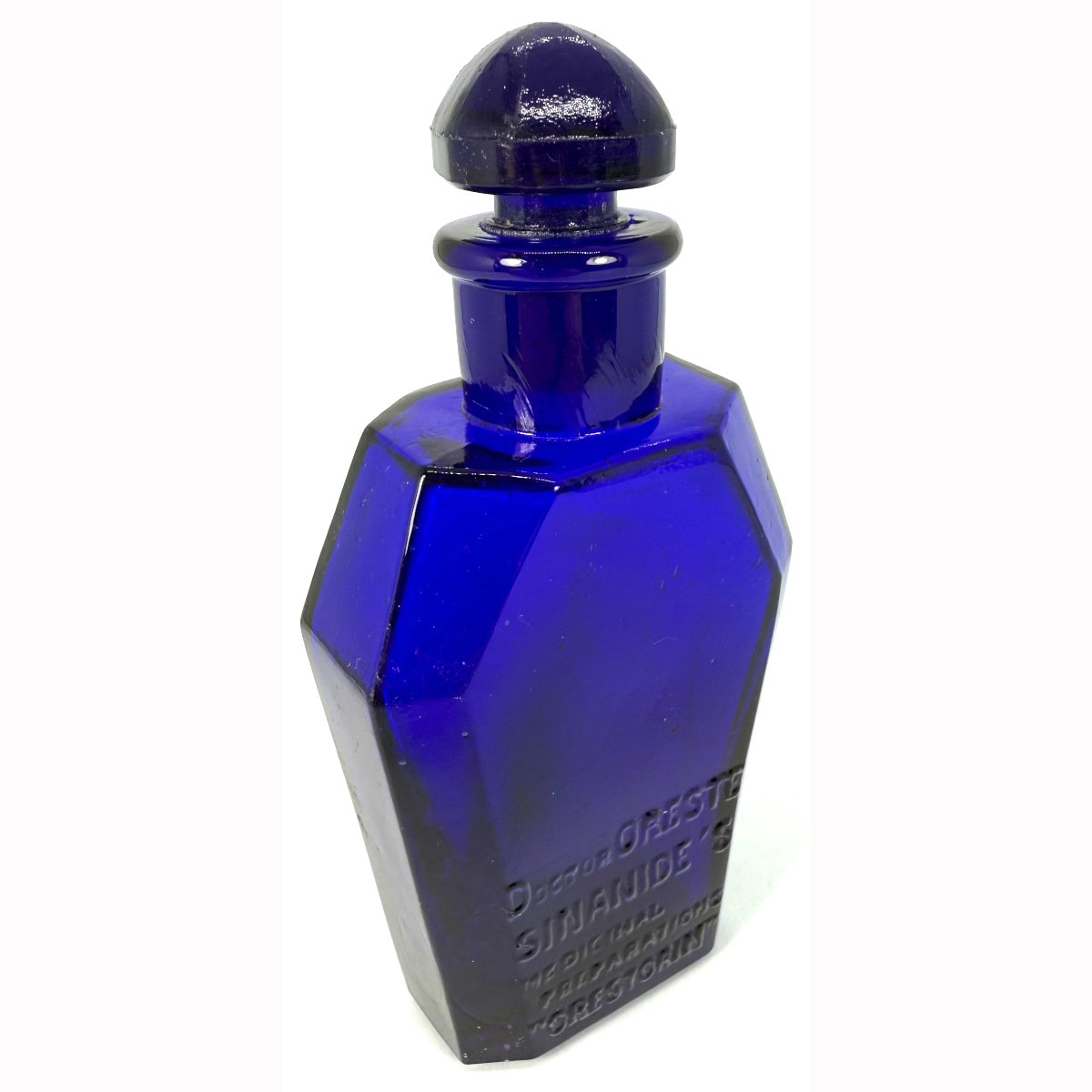 Poison. Doctor Oreste Sinanide's Medicinal Preparations. Oresterin. Cobalt Blue fancy coffin shape. Original stopper. 118 mm with stopper