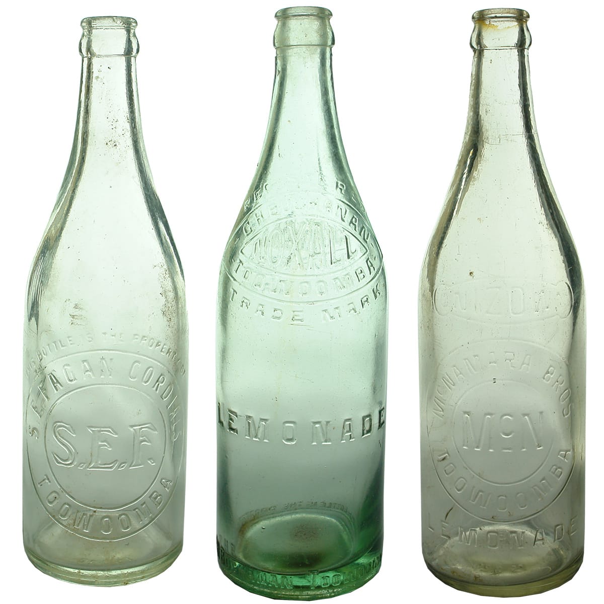 3 Toowoomba Crown Seals. S. E. Fagan, Aqua; G. H. Buchanan, Noxall, Lemonade Aqua; McNamara Bros, Onizown, Lemonade. Clear. (Queensland)