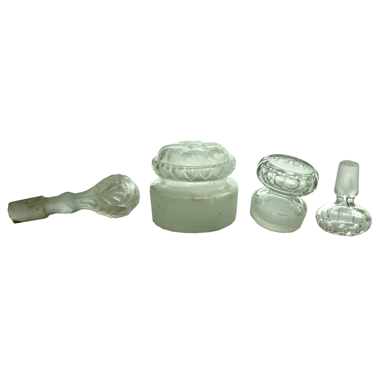 Glassware. Four large clear glass decanter and jar stoppers.