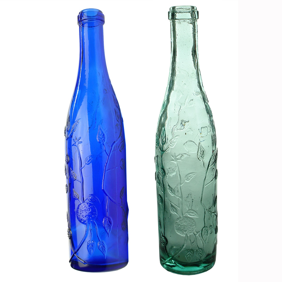 2 Modern bottles that look like Roses Cordials. Cobalt Blue & Aqua. Leaves & Fruit pattern embossed. No other markings.