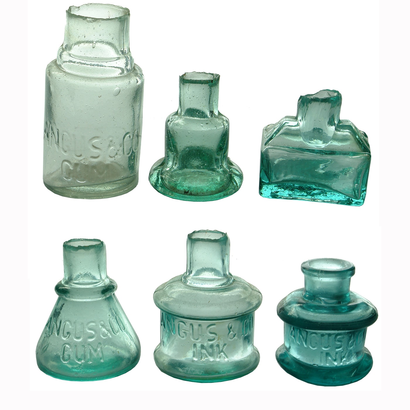 Inks/Gums. 6 glass Angus inks and gums: 1. Angus & Co Gum. Cylinder. Shear Lip. 2. J. Angus Bell Ink. Shear Lip. 3. J. Angus Cabin Ink. Shear Lip. 4. Angus & Co Gum. Bell Ink. Shear Lip. Aqua. 5. Angus & Co Ink. Cotton Reel. Large. Shear Lip. Aqua. 6. Angus & Co Ink. Cotton Reel. Applied top, spun finish. Aqua.