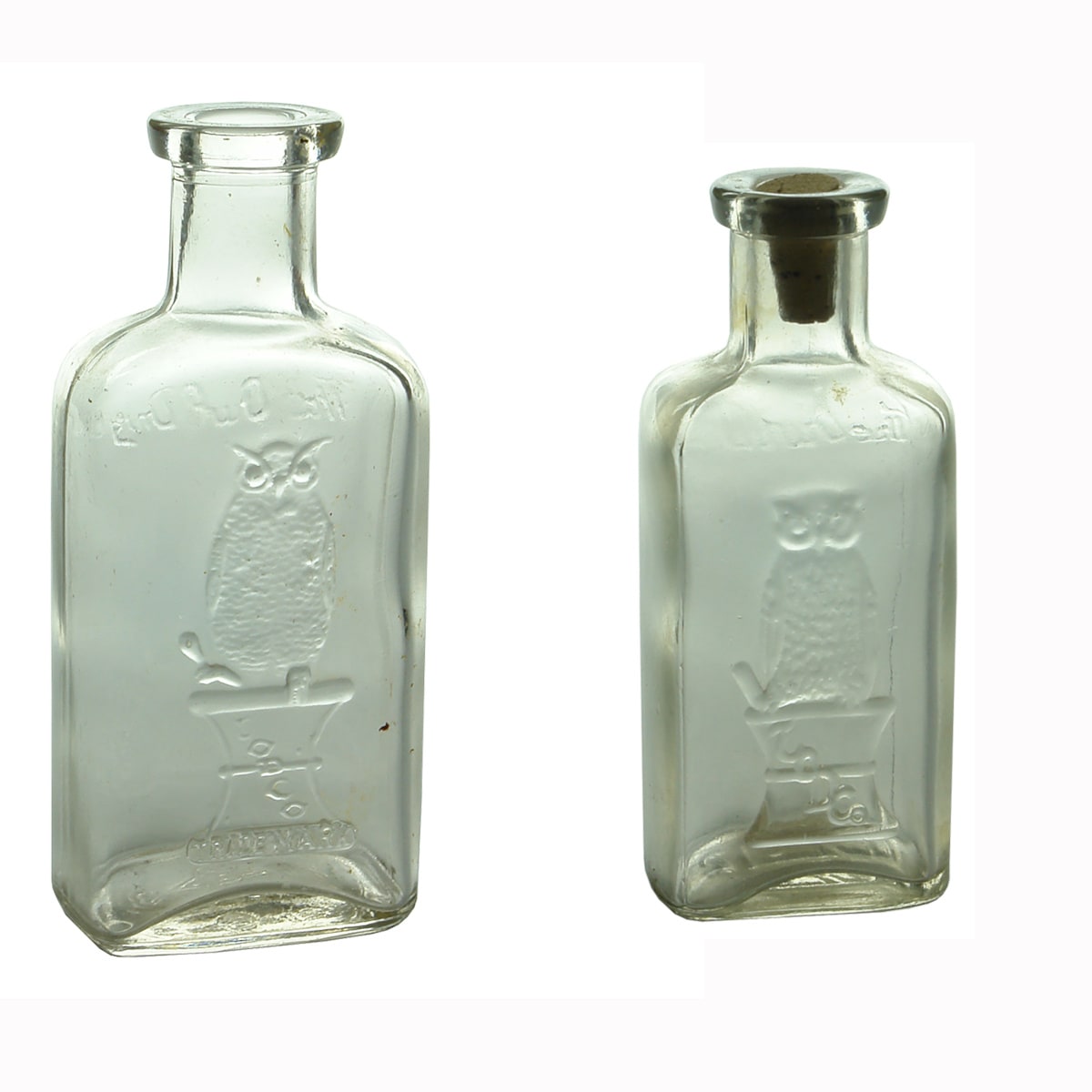 2 Medicines. The Owl Drug Co. Two Wing. Clear. Rounded Oblong. 114 mm and The Owl Drug Co. Two Wing. Clear. Rounded Oblong. 101 mm. (USA)