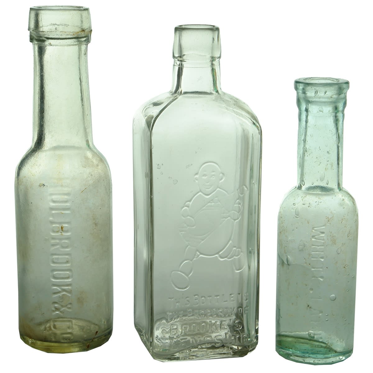 Miniatures. 1. Holbrook & Co. Vulcan. Machine made. Clear. 2 oz. 2. Brooke's Lemos Ltd. Machine made. Clear. 4 oz. 3. White Label. Aqua. 1 oz.