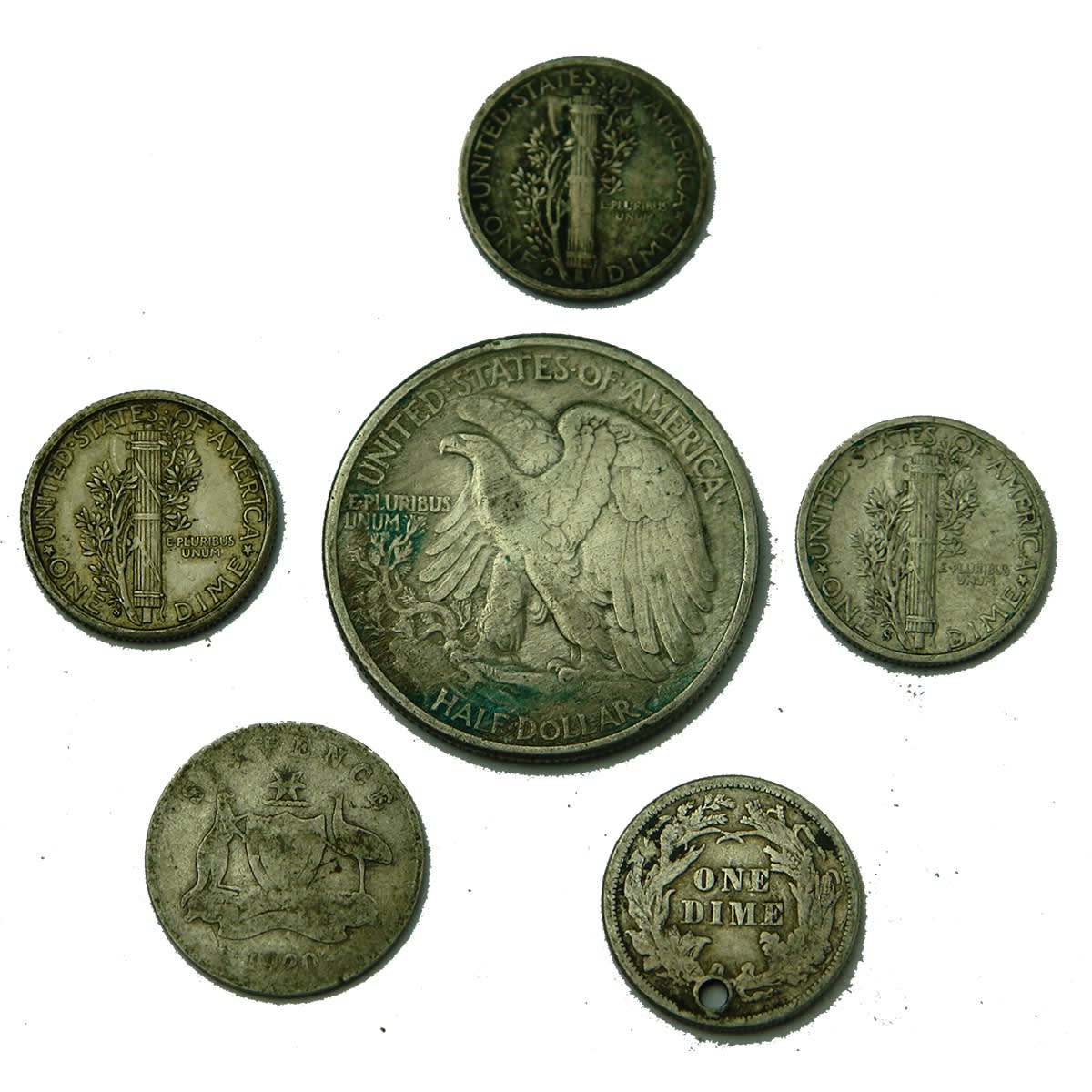 Numismatics. 6 x silver coins: 3 x United States One Dime (1916, 1935, 1942), 1942 United States Half Dollar, 1876 United States One Dime, 1920 Australian Sixpence.