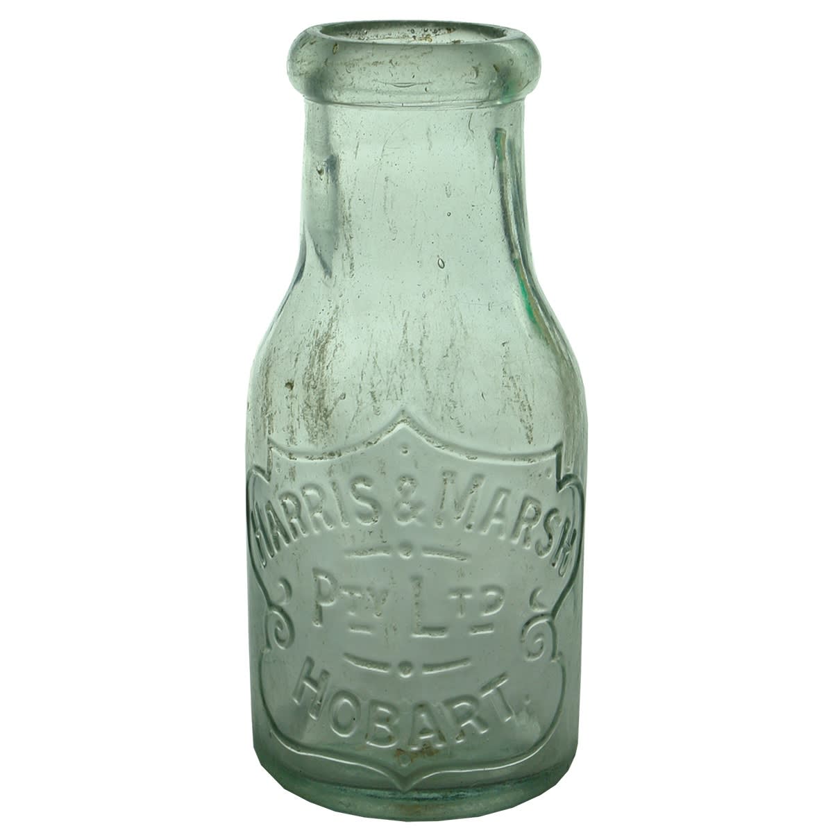 Household. Harris & Marsh Pty Ltd, Hobart. Long neck cream bottle with round lip. Clear/Light Aqua. 1/2 Pint. (Tasmania)