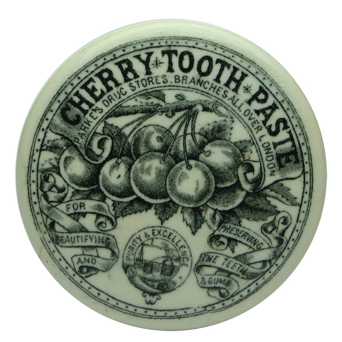 Pot Lid. Parke's Drug Stores Cherry Tooth Paste. London. Black & White. 65 mm diameter.