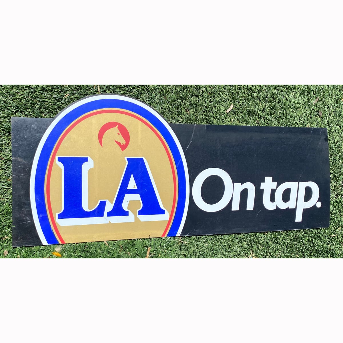 Plastic sign. LA On Tap. Tooths Horse Head Logo. (Not for post. Arrangements will have to be made by winning bidder for pickup or courier delivery)  (Sydney, New South Wales)