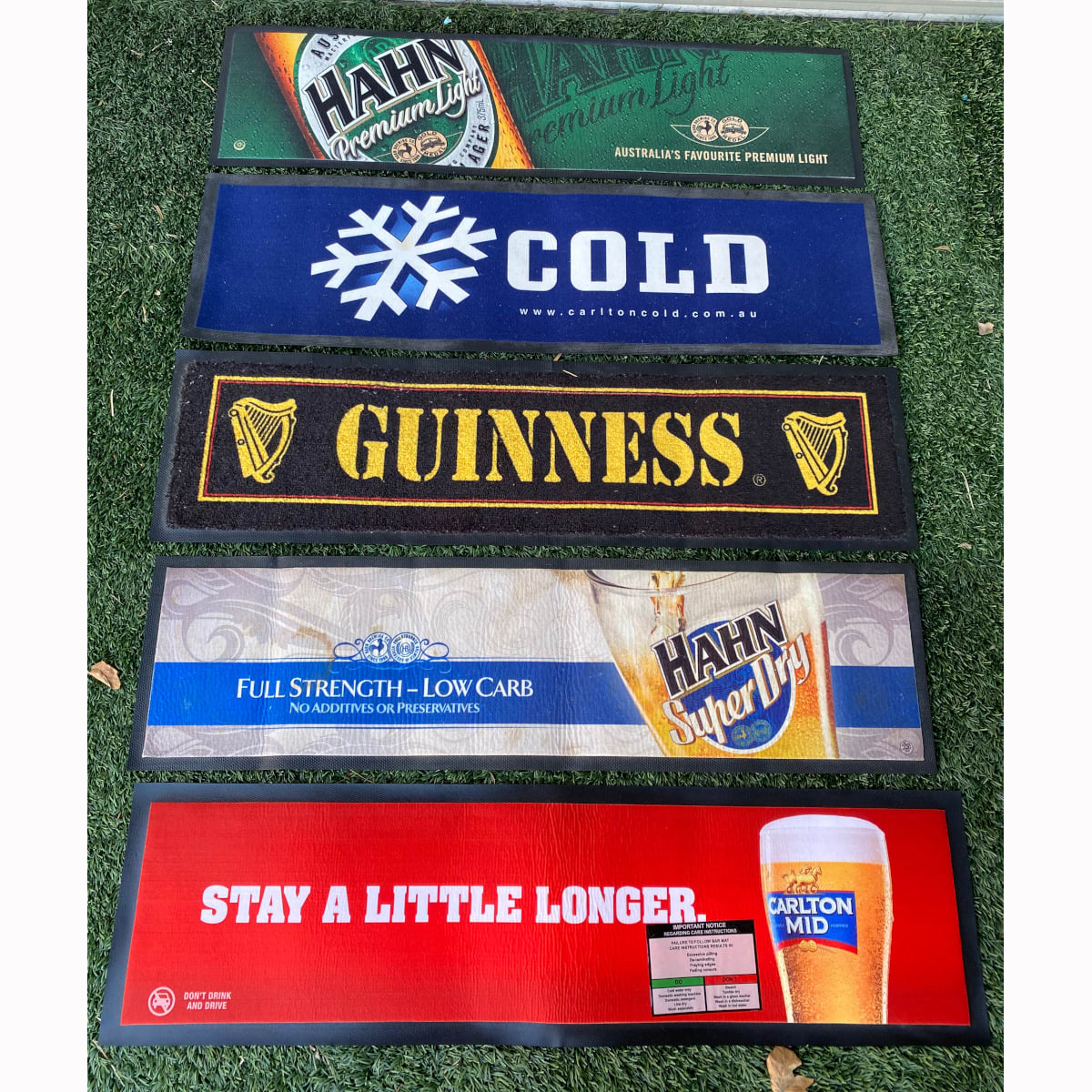5 rubber backed bar mats: Carlton Mid; Hahn Super Dry; Hahn Premium Light; Carlton Cold; Guinness.