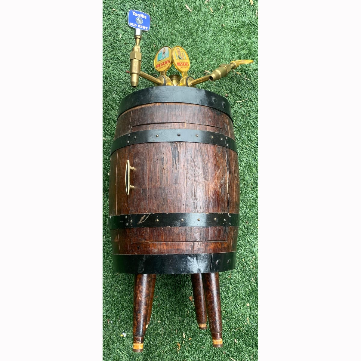 Barrel drinks cabinet. Brass taps with tap markers for Reschs Draught x 3 and Tooths Old Kent x 1. (Not for post. Arrangements will have to be made by winning bidder for pickup or courier delivery)