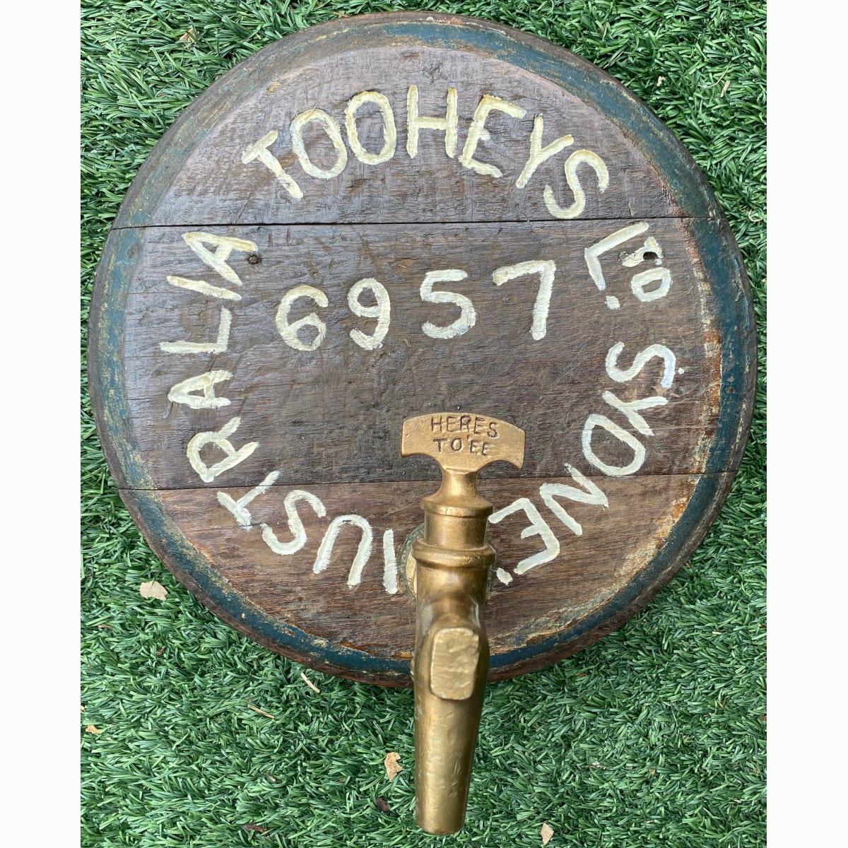 Barrel end with brass tap. Heres To'ee on tap handle. Tooheys Limited brass tap surround. Sydney Australia. 6957. (New South Wales)