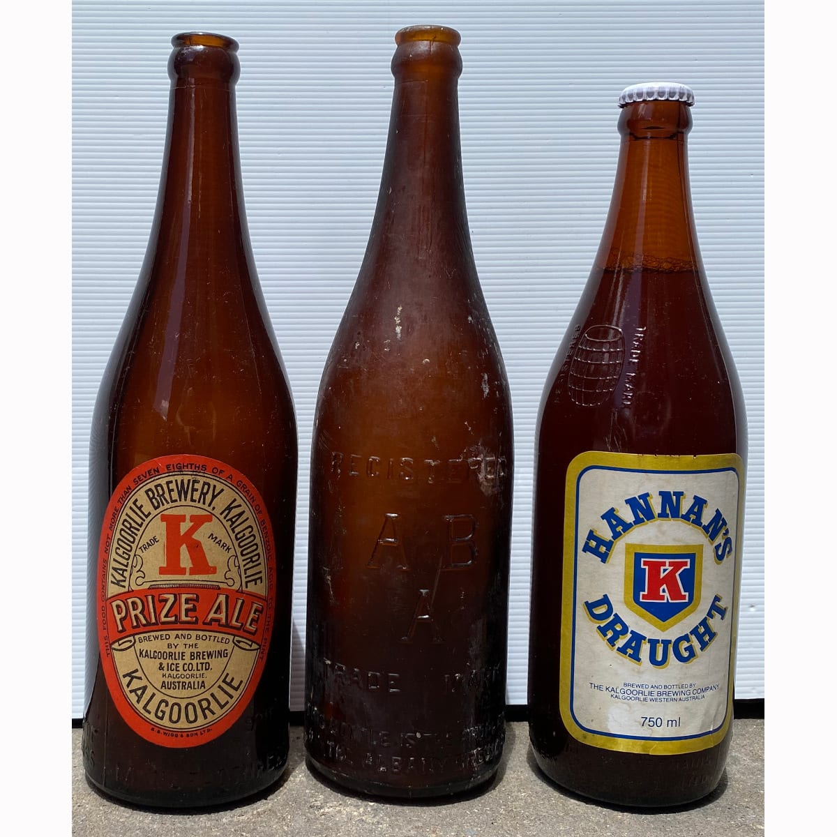 3 WA Beer Bottles: Albany Brewery; 1929 Western Australian Glass Manufacturers with Kalgoorlie Brewing & Ice Co label; Swan brewery bottle with Hannans Draught Kalgoorlie Brewing Company label. (Western Australia)