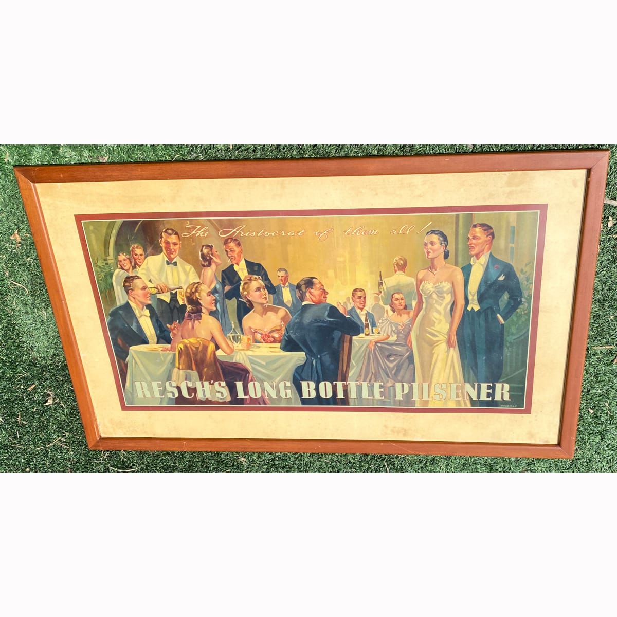 Original large Cardboard Advertising Sign. Resch's Long Bottle Pilsener. The Aristocrat of them all. Woodman. Sophisticated club scene, formally dressed men and women, white coated waiters and lots of Reschs bottles. (Not for post. Arrangements will have to be made by winning bidder for pickup or courier delivery)   (New South Wales)