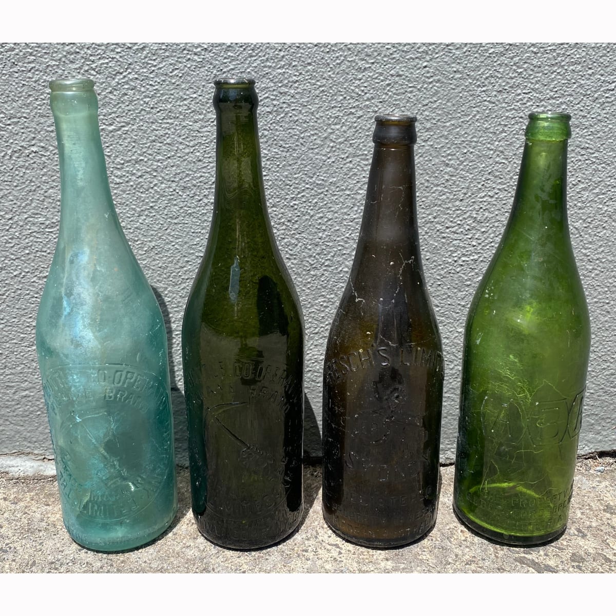 4 Beer Bottles: Aqua Pickaxe; Green Pickaxe; Amber/Green Reschs Limited; Bright Green Abbotsford Brewery ABA.