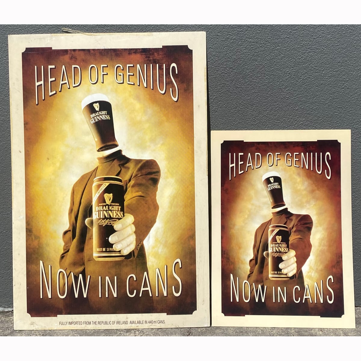 2 Guinness Draught Posters: Large Corflute Head of Genius. Now in Cans Fully Imported from Ireland 440 ml; Smaller Cardboard sign. (Not for post. Arrangements will have to be made by winning bidder for pickup or courier delivery)