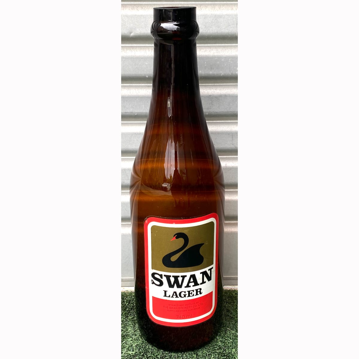 Giant advertising Glass Bottle. Swan Lager. The Swan Brewery Co Ltd Perth. 628 mm tall. (Western Australia) (Not for post. Arrangements will have to be made by winning bidder for pickup or courier delivery)