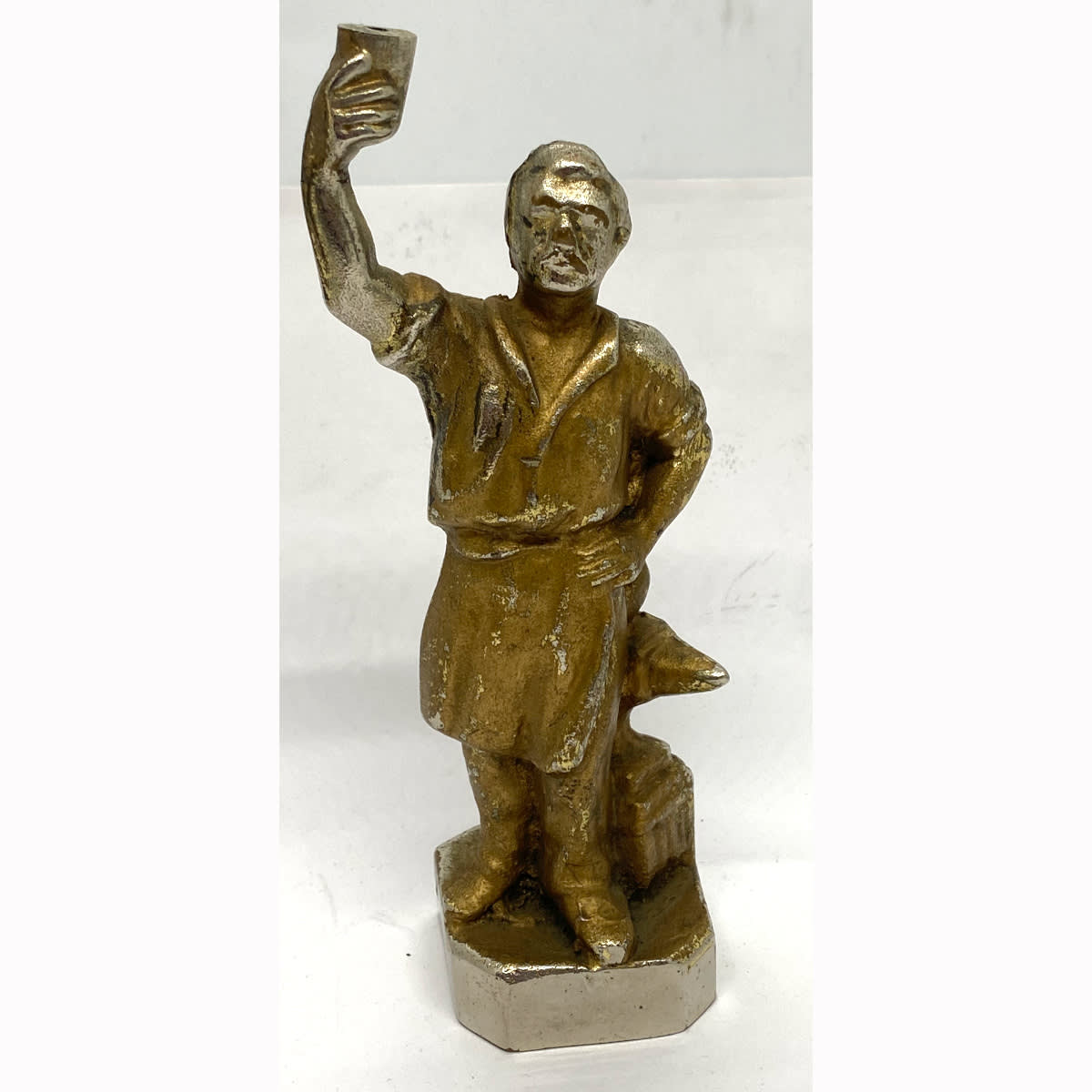 Heavy statuette (Just under 1.5 kg). No branding but is a Blacksmith next to his anvil raising a glass. Should have Here's To'ee on it! (Tooheys, Sydney, New South Wales)
