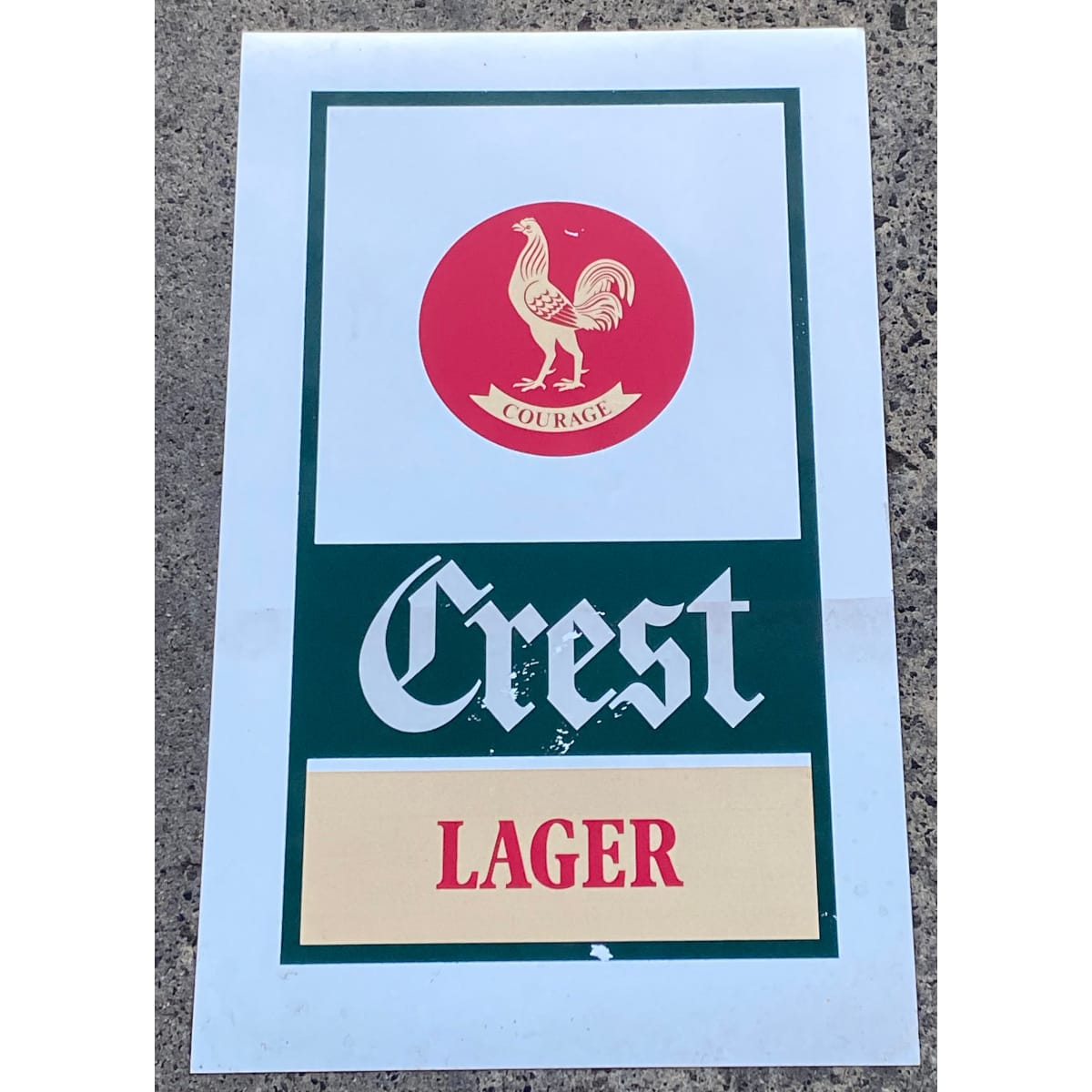 Advertising. Courage Crest Lager sign on silver background. (Not for post. Arrangements will have to be made by winning bidder for pickup or courier delivery)