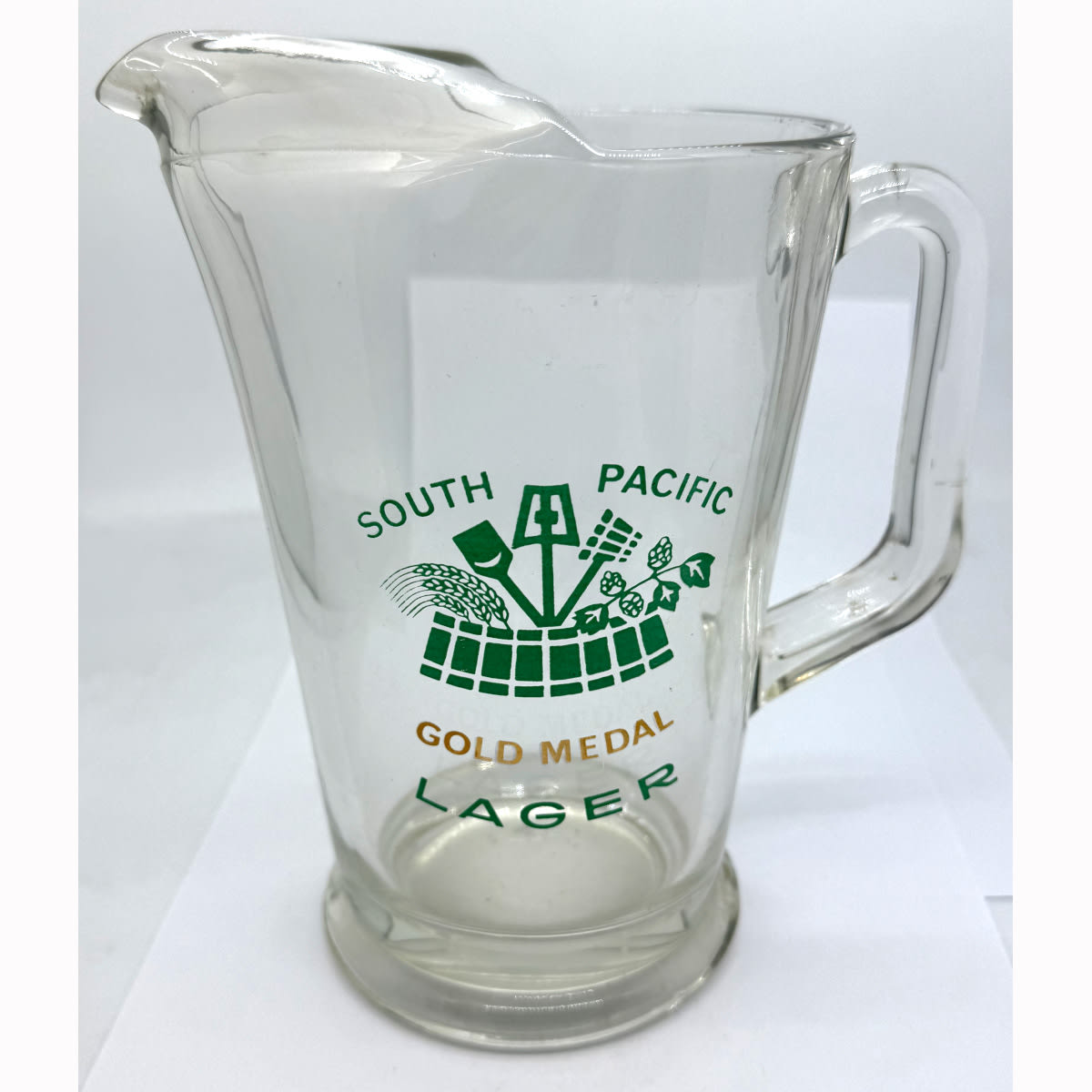 Glass Beer Jug with ceramic label type print. South Pacific Gold Medal Lager. Green & Gold.