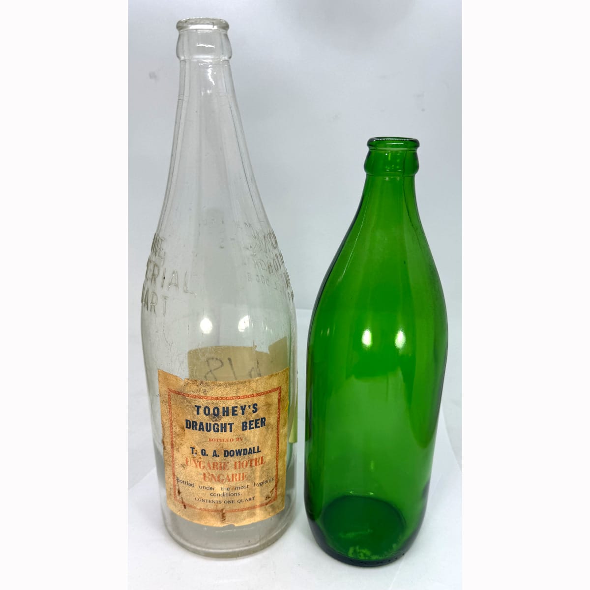 2 Bottles: McCarthy Bottle Merchants Alexandria Quart with T. G. A Dowdall, Ungarie Hotel label; Plain green prototype like bottle from AGM.