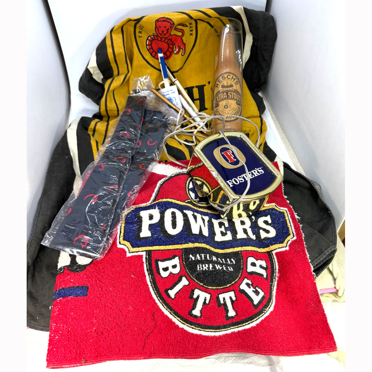 9 Promo Items: Reschs Brush; Tooth logo Tie (still in plastic wrap); 2002 Canathon Pens; Powers Pen; Millers Pencil; Fosters light; Powers Bar Towel; Reschs Apron.