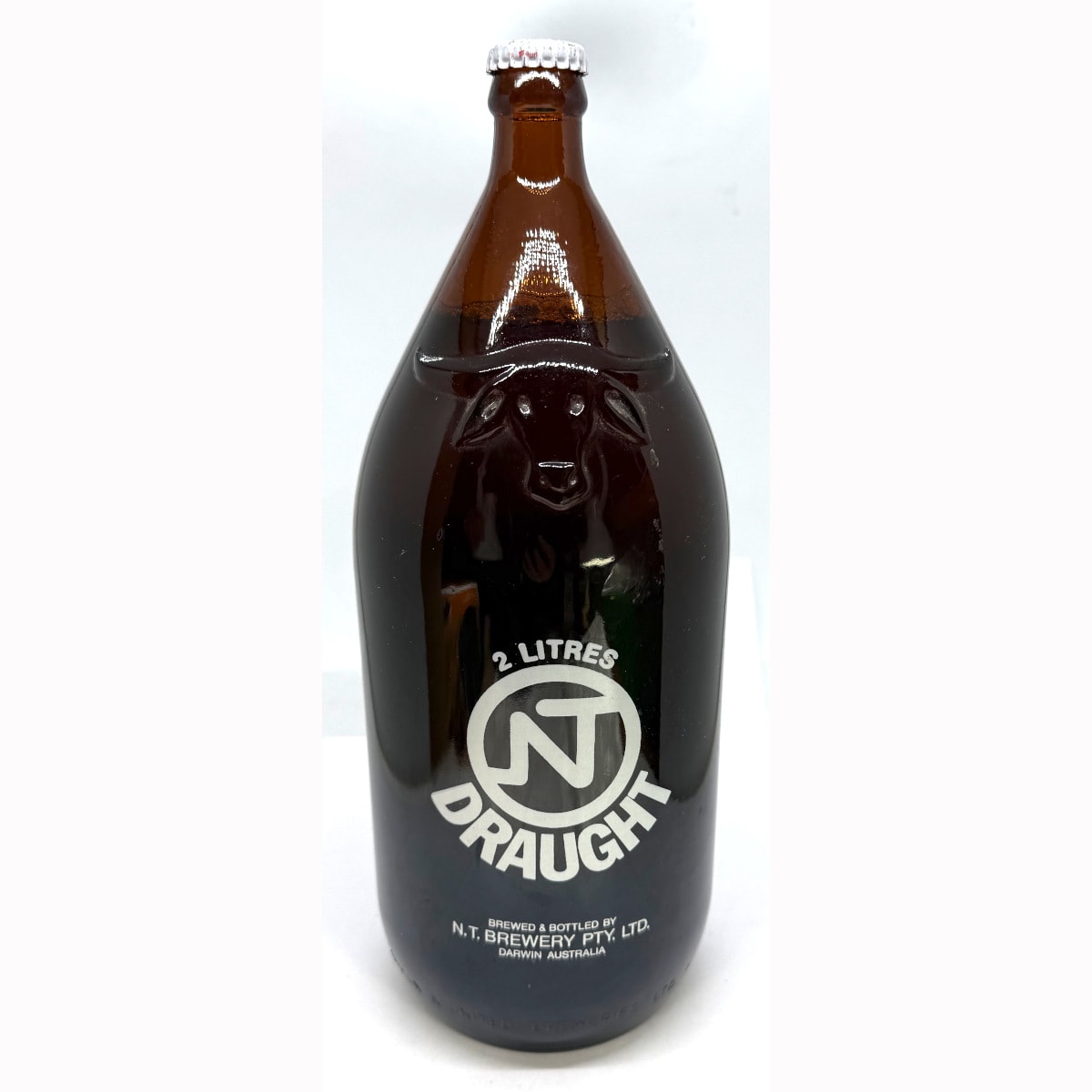 Darwin Stubby. NT Draught. N. T. Brewery Pty Ltd, Darwin. Original Label: Halley's Comet, Alice Springs Northern Territory April 1986.
