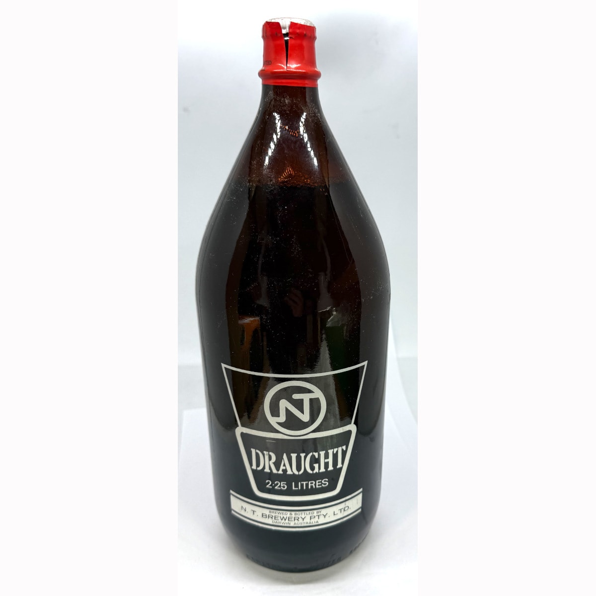 Darwin Stubby. NT Draught. N. T. Brewery Pty Ltd, Darwin. Original Capsule: Quality guaranteed only if capsule intact.