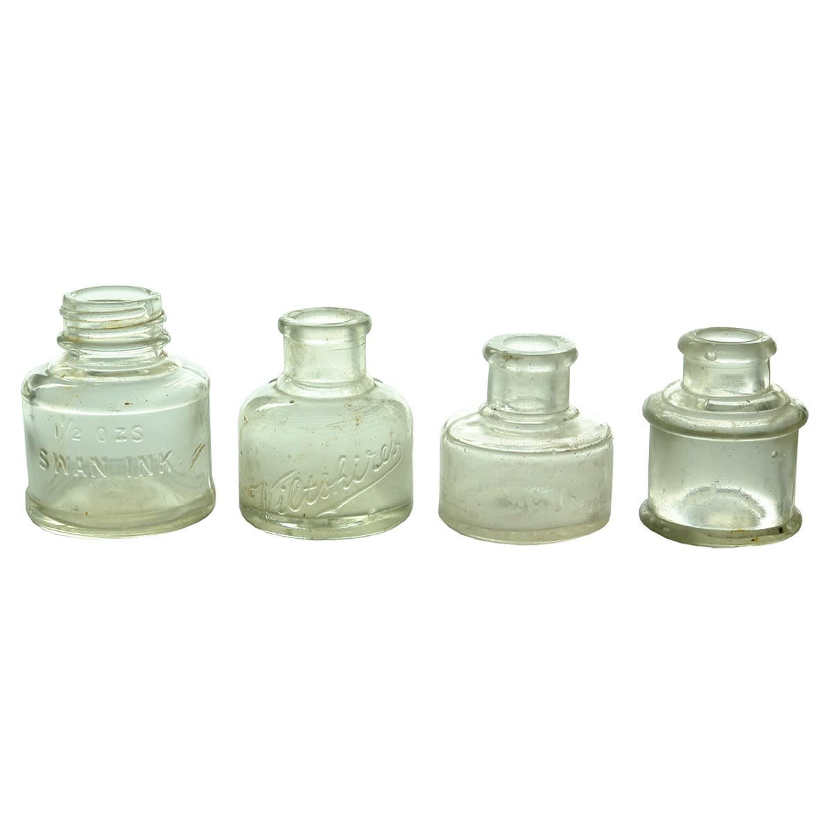 Inks. 1. Swan Ink. Screw top. 1 1/2 oz. 2. Wiltshire's. 1 oz. 3. HIggins Inks, Brooklyn, N. Y. 1 oz. 4. UGB made cotton reel ink. 1 oz. 5. Large Carter's Cotton Reel Ink. 2 oz. 6. Stephen's Inks. 1 oz. 7. Unbranded cotton reel ink. 1 oz. 8. Higgins' Inks, Brooklyn, N. Y. 3/4 oz. 9. Unbranded cotton reel ink. 3/4 oz.