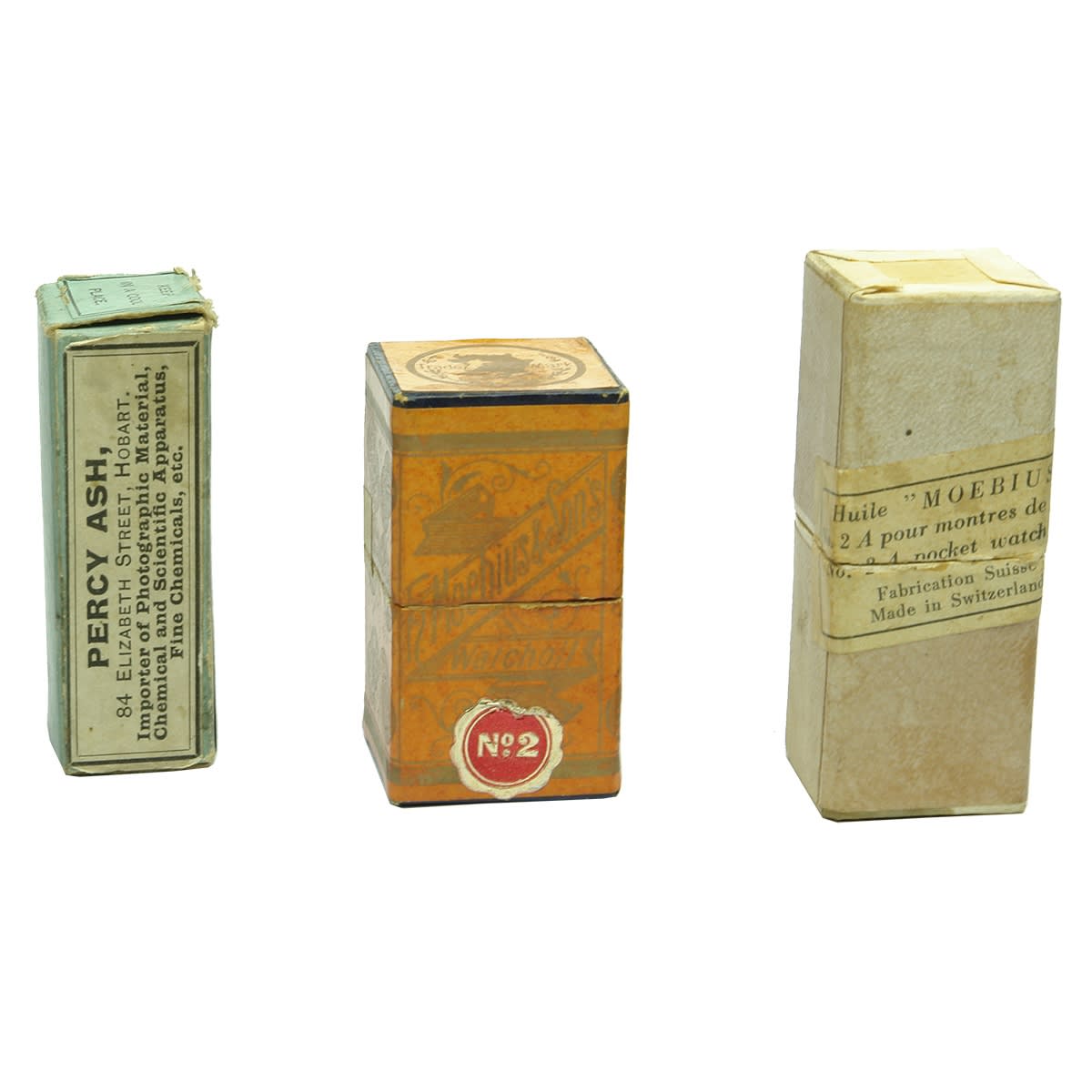 4 Medicine like bottles. Percy Ash, Hobart Gold Chloride and Sodium Phosphate containers in cardboard package. 2 x F. Moebius & Sons watch Oil items; Shear lip yellow medicine.