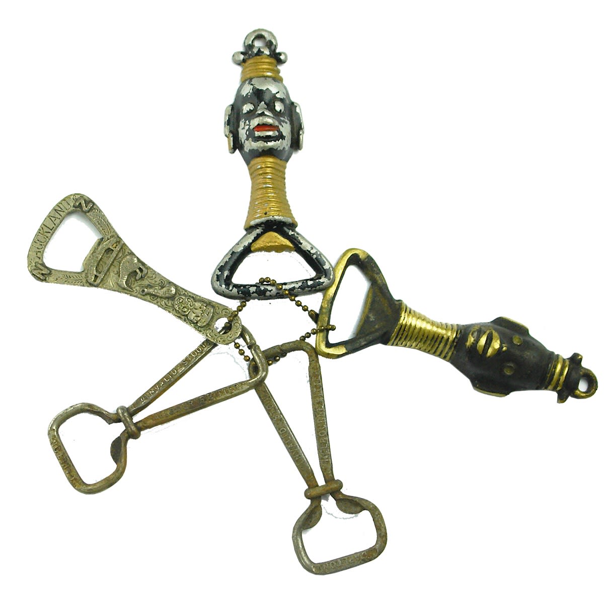 Openers. 5 x crown seal bottle openers, two African, one Auckland and two Foster's.