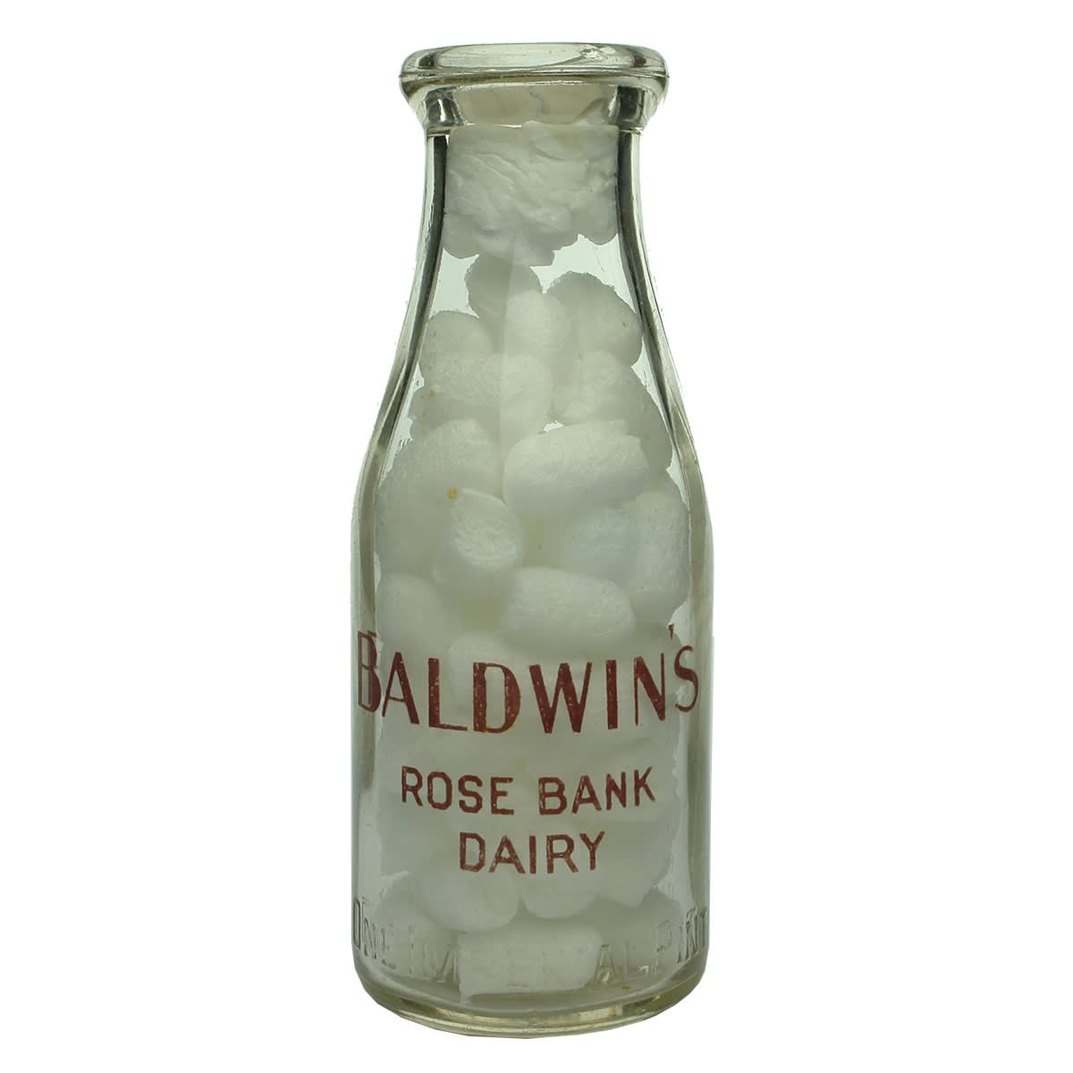 Embossed & Ceramic Label Milk. E. Baldwin's Rose Bank Dairy, South Melbourne. Wad lip. Ceramic Label. 1 Pint. Base Number: 147. (Victoria)