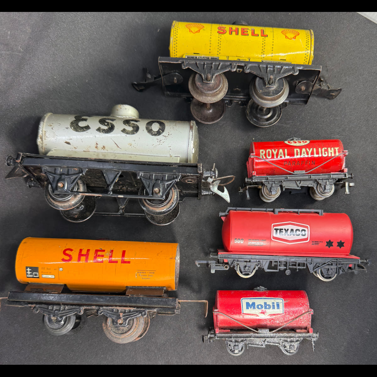 6 Model Train Carriages with Oil Company Advertising. Shell, Texaco, Mobil & Esso. 5 x Tin, Texaco is plastic.