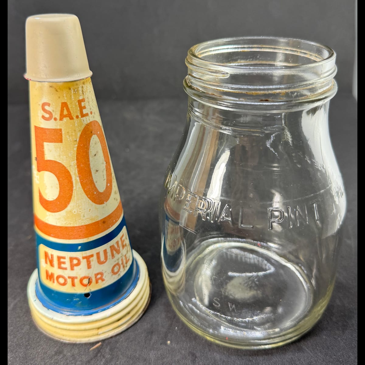 Tin oil top pourer. Neptune Motor Oil. SAE 50. Generic Pint Bottle.