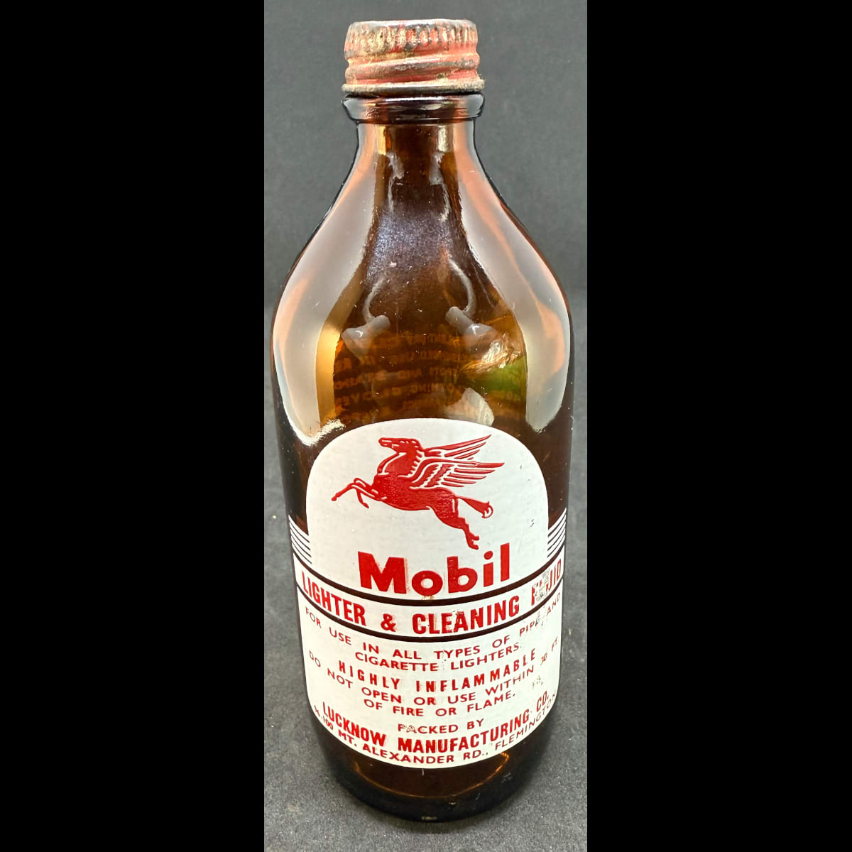 Ceramic label bottle. Mobil Lighter & Cleaning Fluid. Lucknow Manufacturing Co. Mt Alexander Rd., Flemington. Vacuum Oil Company Pty. Ltd. Pegasus logo.