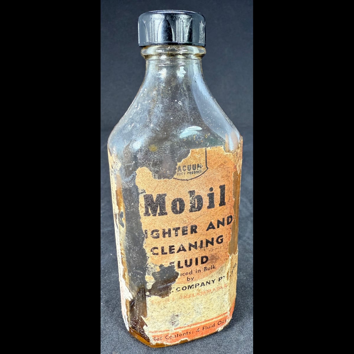 Bottle. Label for Mobil Lighter & Cleaning Fluid. Vacuum Oil Co. 4 oz. Screw top bottle with original cap.