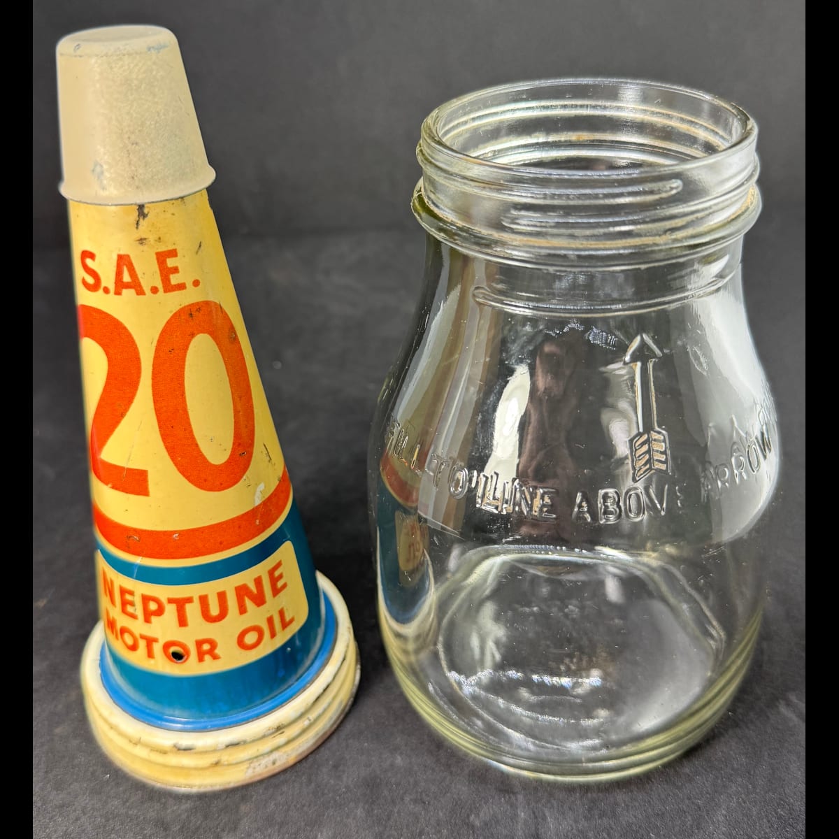 Tin oil top pourer. Neptune Motor Oil. SAE 20. Generic Pint Bottle.