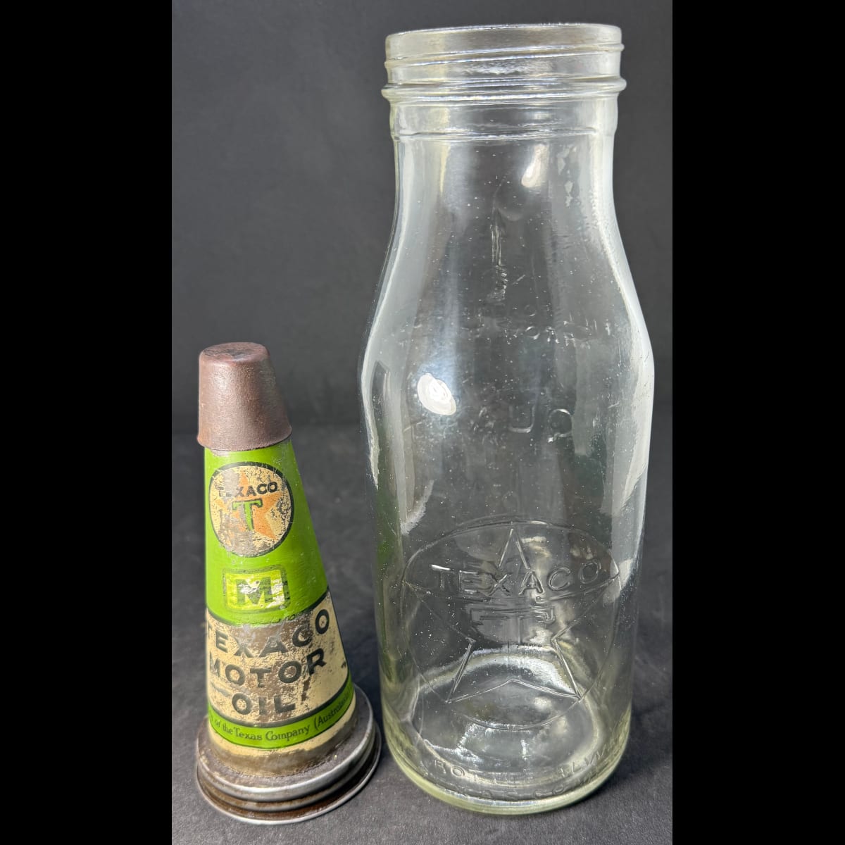 Tin oil top pourer and embossed bottle. Texaco Motor Oil. Texas Company (Australasia) Limited. Quart. Early style top.