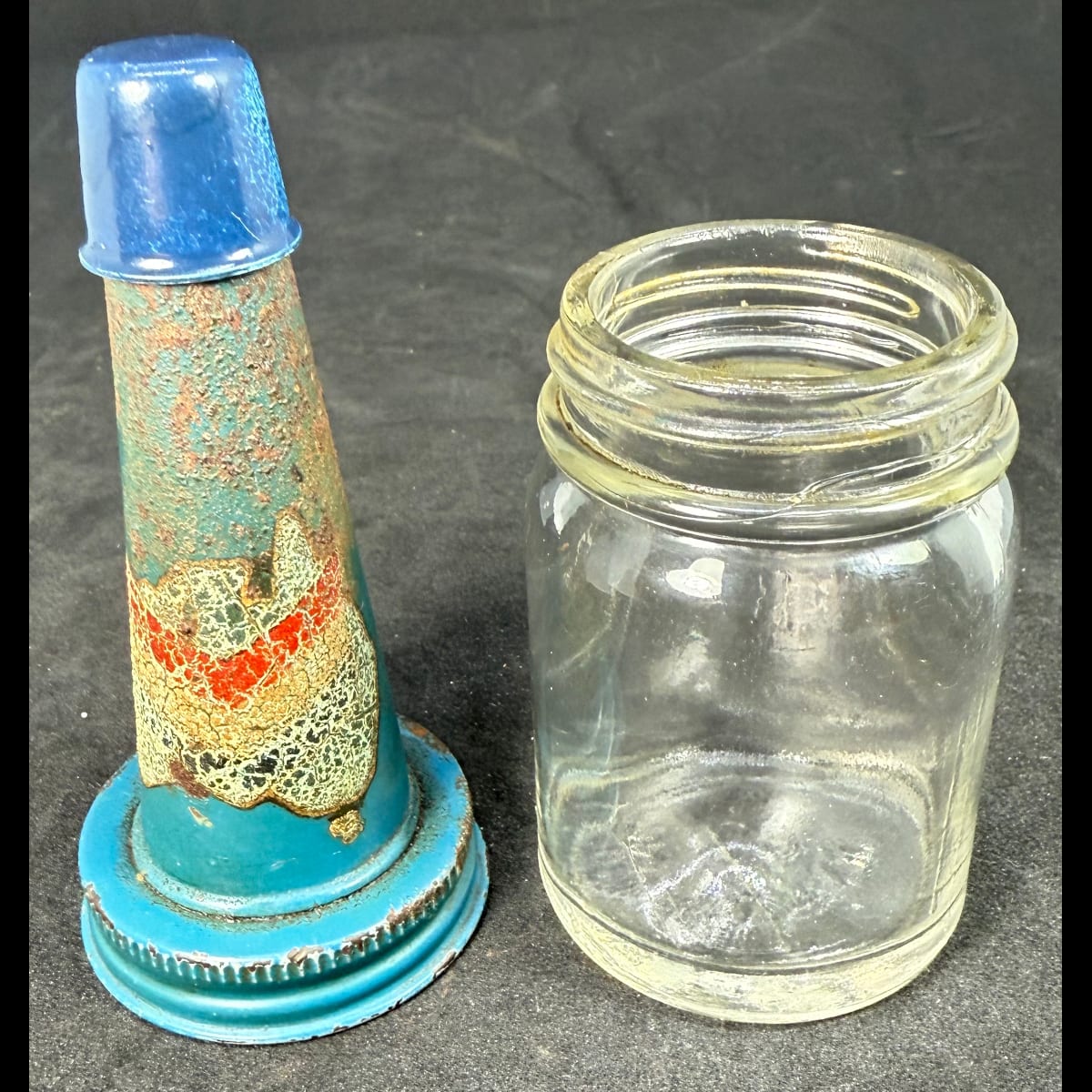 Tin oil top pourer on plain jar. Chevron on Australia logo. 4 oz.