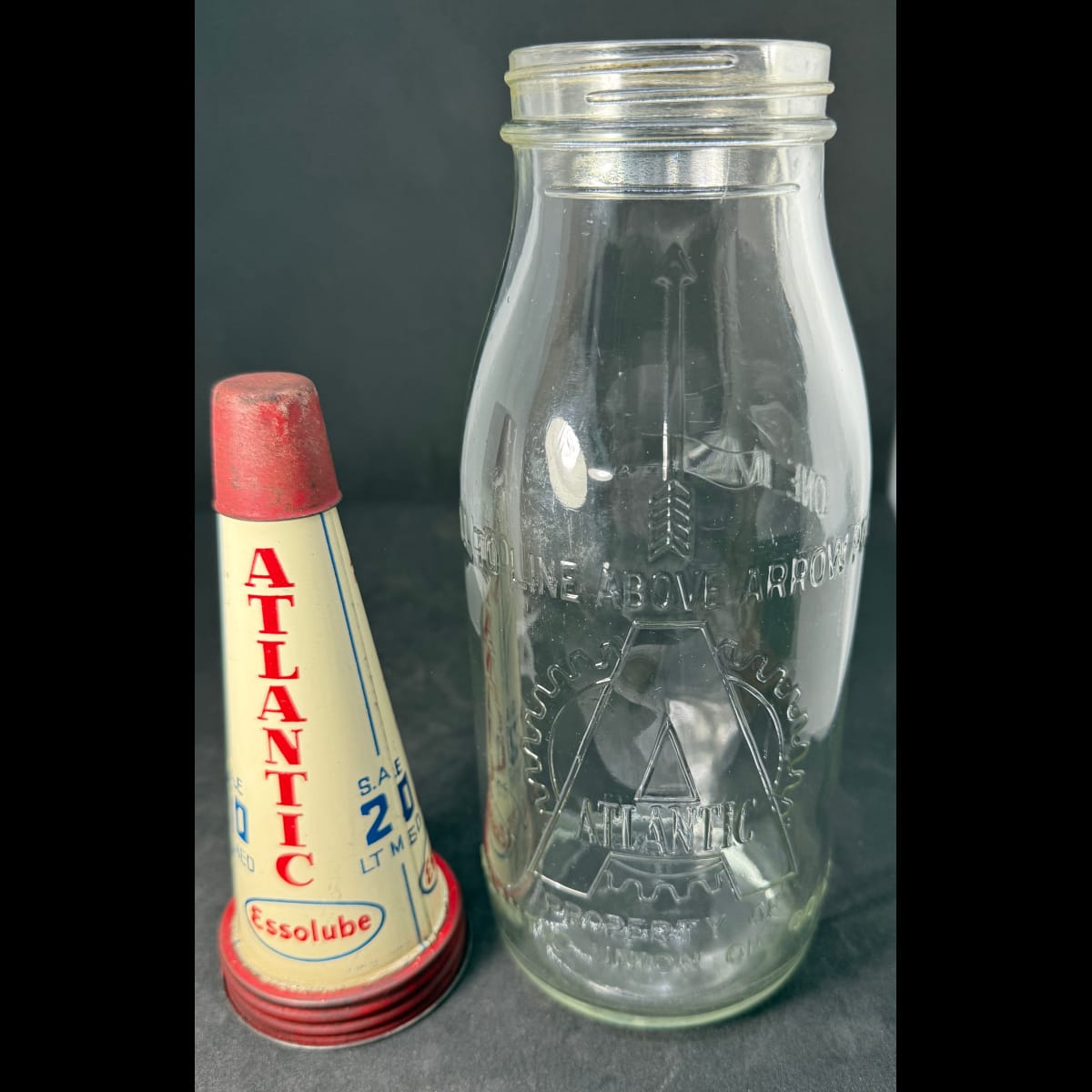 Tin oil top pourer and embossed bottle. Atlantic Essolube SAE 20. Atlantic Union Oil Co Ltd Quart bottle.