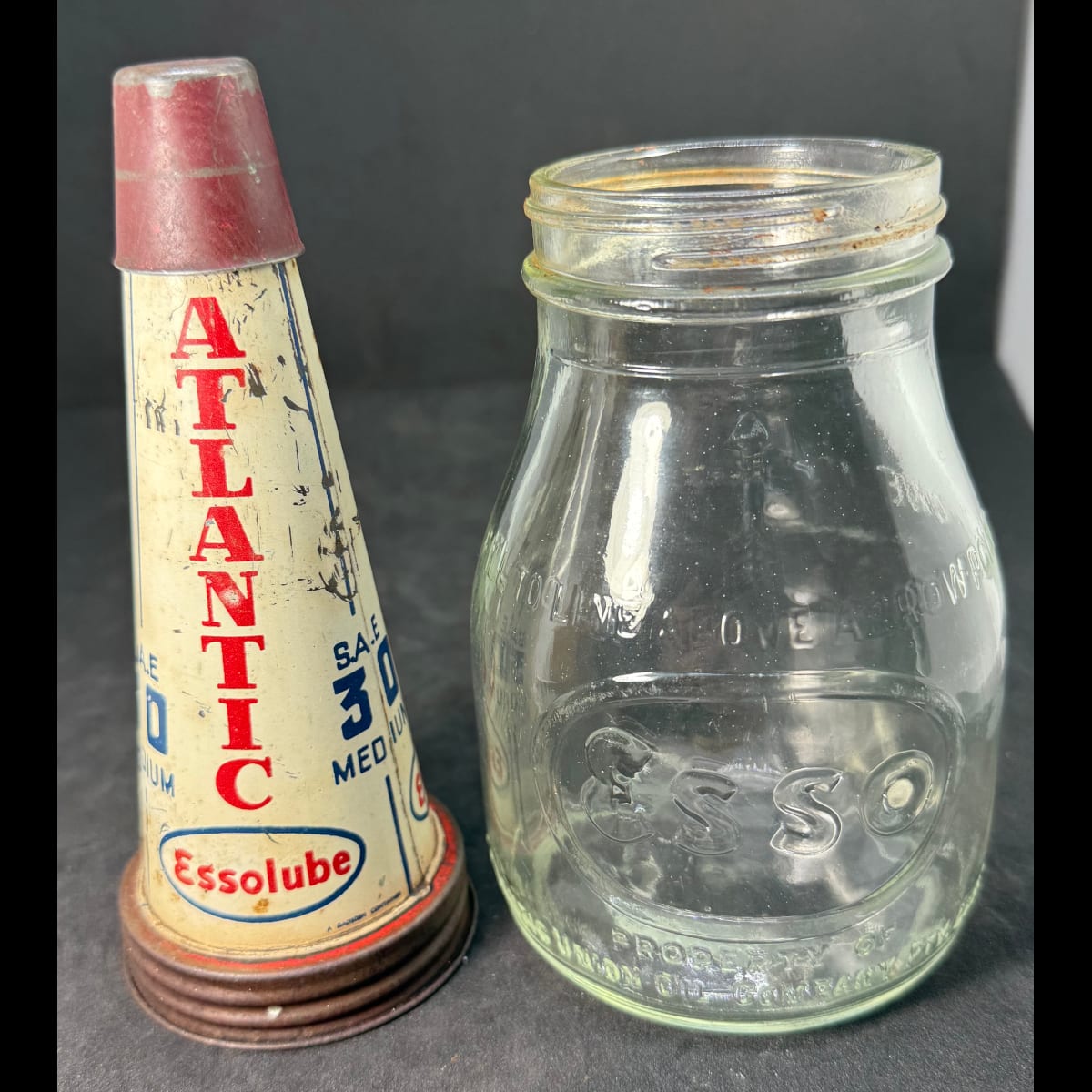 Tin oil top pourer and embossed bottle. Atlantic Essolube SAE 30. Esso branded Atlantic Union Oil Company Pty Limited bottle.