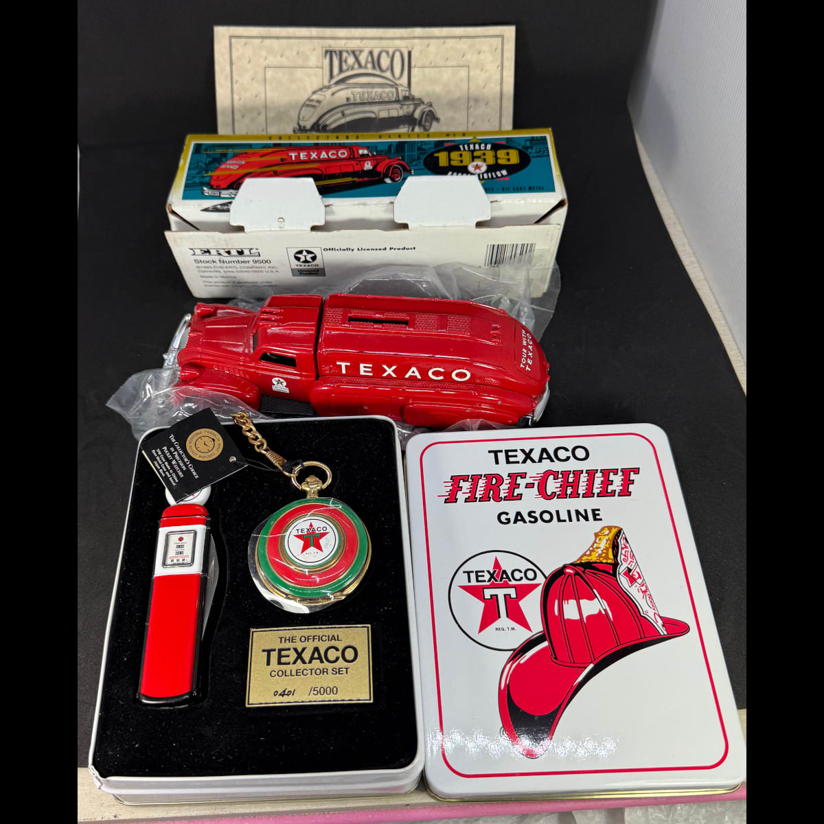 2 Texaco Collectors Series items: Texaco 1939 Dodge Airflow model/moneybox in original box; Texaco Fire-Chief Gasoline tin with Collectors set of Pocket Knife and Franklin Mint Pocket Watch (No. 401 of 5000).