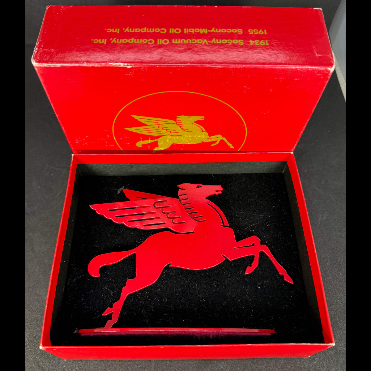 Presentation box and statuette/sculpture of Pegasus. Vacuum Oil Co; Mobil Oil Company; Socony; Standard Oil Co of New York and so on around the box. Employees Gift.