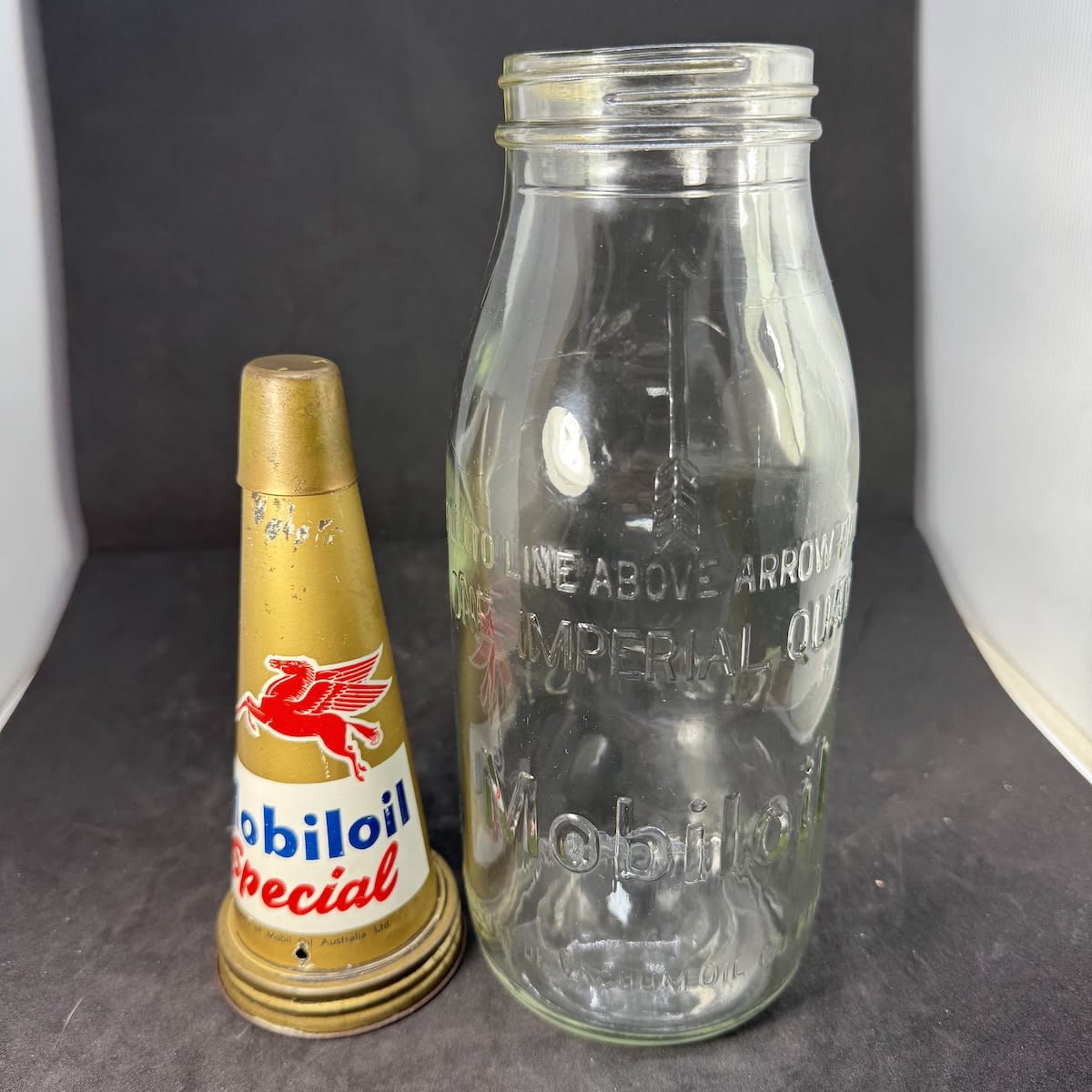 Tin oil top pourer and embossed bottle. Mobiloil Special. Pegasus facing left. Mobil Oil Australia. Mobiloil Imperial Quart Vacuum Oil Co bottle.