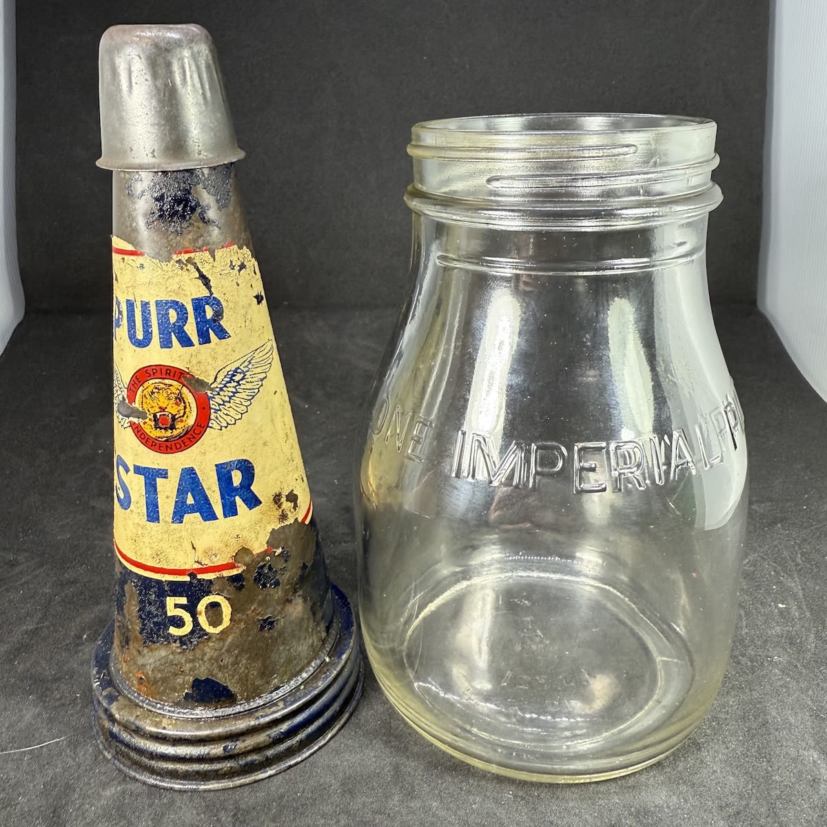 Tin oil top pourer and pint bottle. Purr Star 50. The Spirit of Independence. Tigers Head. Pint bottle.