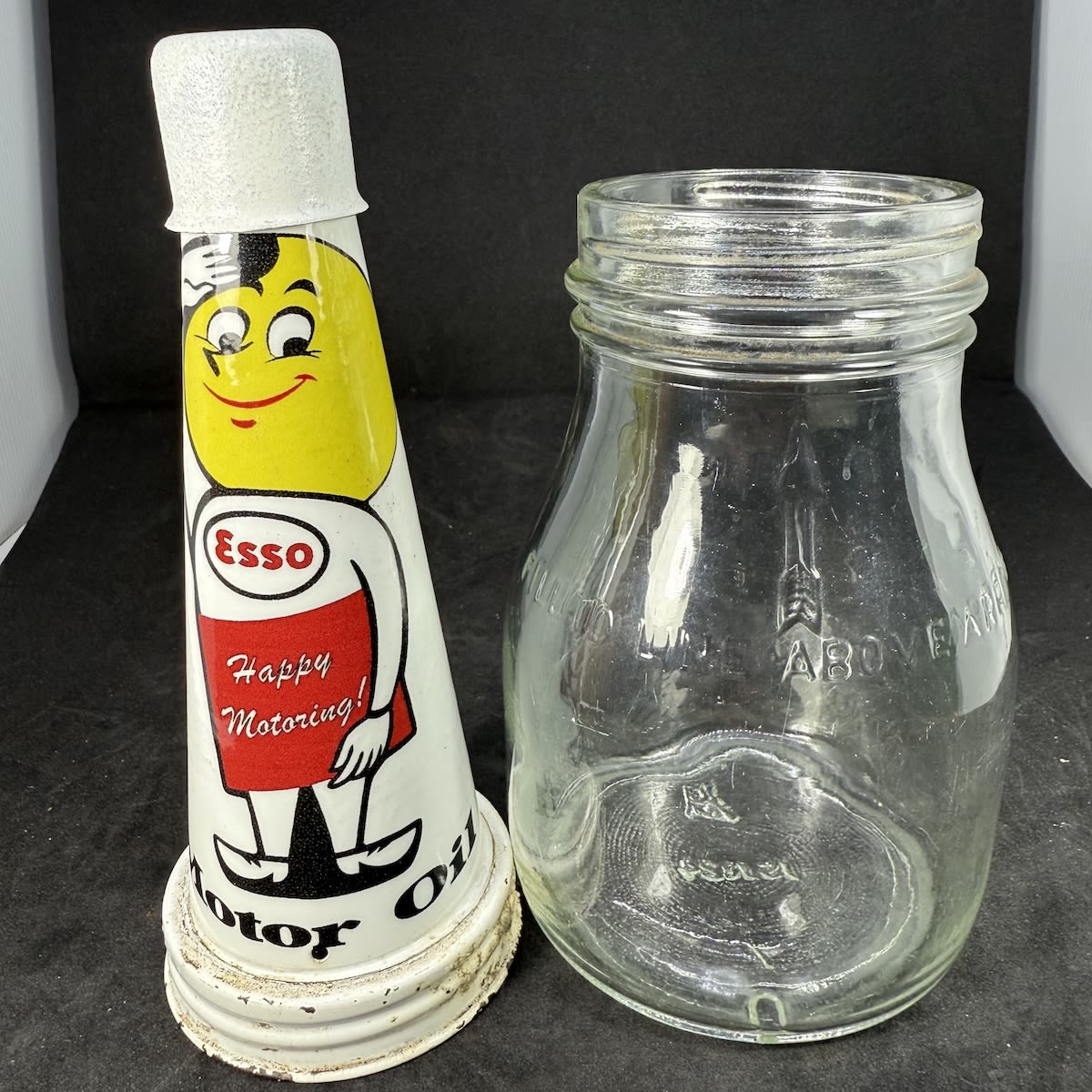 Tin oil top pourer and plain pint bottle. Plastic wrap - Esso drip man. Happy Motoring. Motor oil.